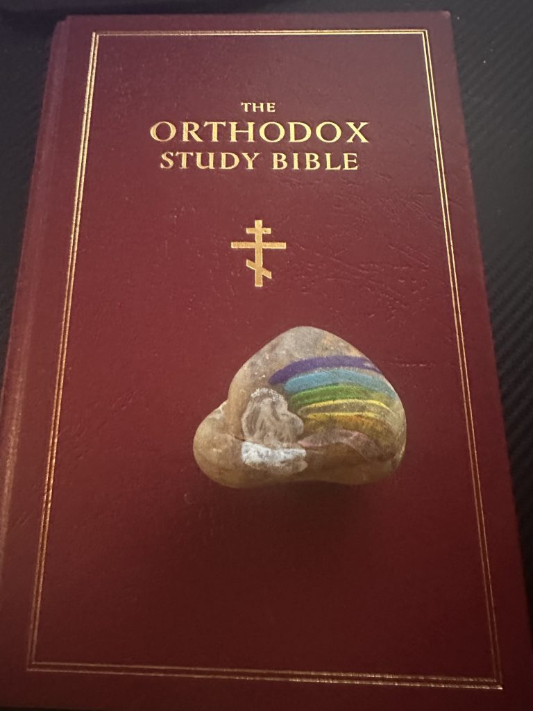 Rock with Rainbow painted on it